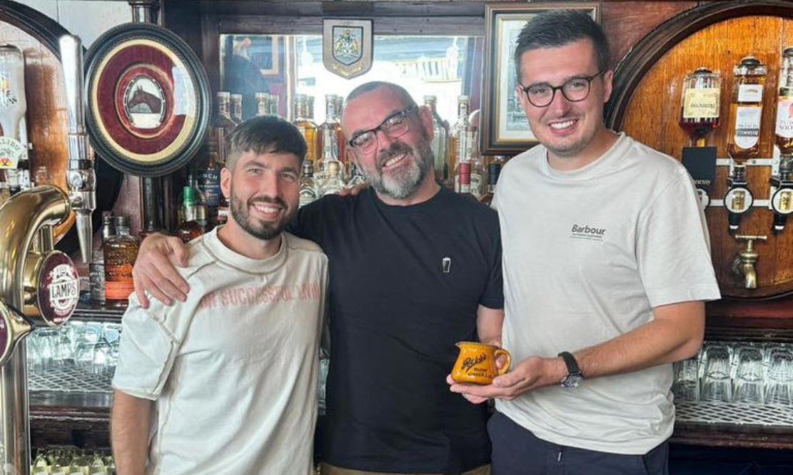 Ben Usher and Chris Wilson with Michael Murphy (centre) at McConville's bar. Ben and Chris presented the bar with a vintage ceramic water jug after appearing on BBC's One's Bargain Hunt. Photo: Chris Wilson